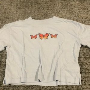 graphic light blue cropped shirt with butterfly’s